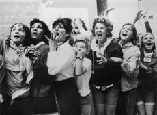 Women and girls in Toronto, Canada screaming with joy during a visit by the Beatles to their city.