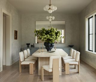 sage green plaster walls in dining room