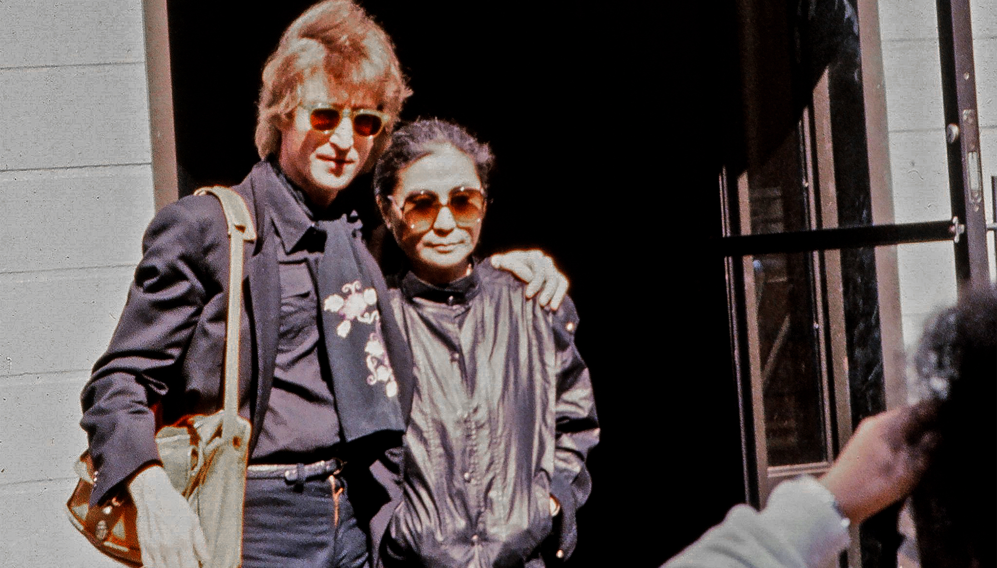 John Lennon and wife Yoko Ono pose for a photo outside the Hit factory recording studio, where they recorded Lennon and Ono&#039;s last album, Double Fantasy, on September 18, 1980 in New York City, New York.