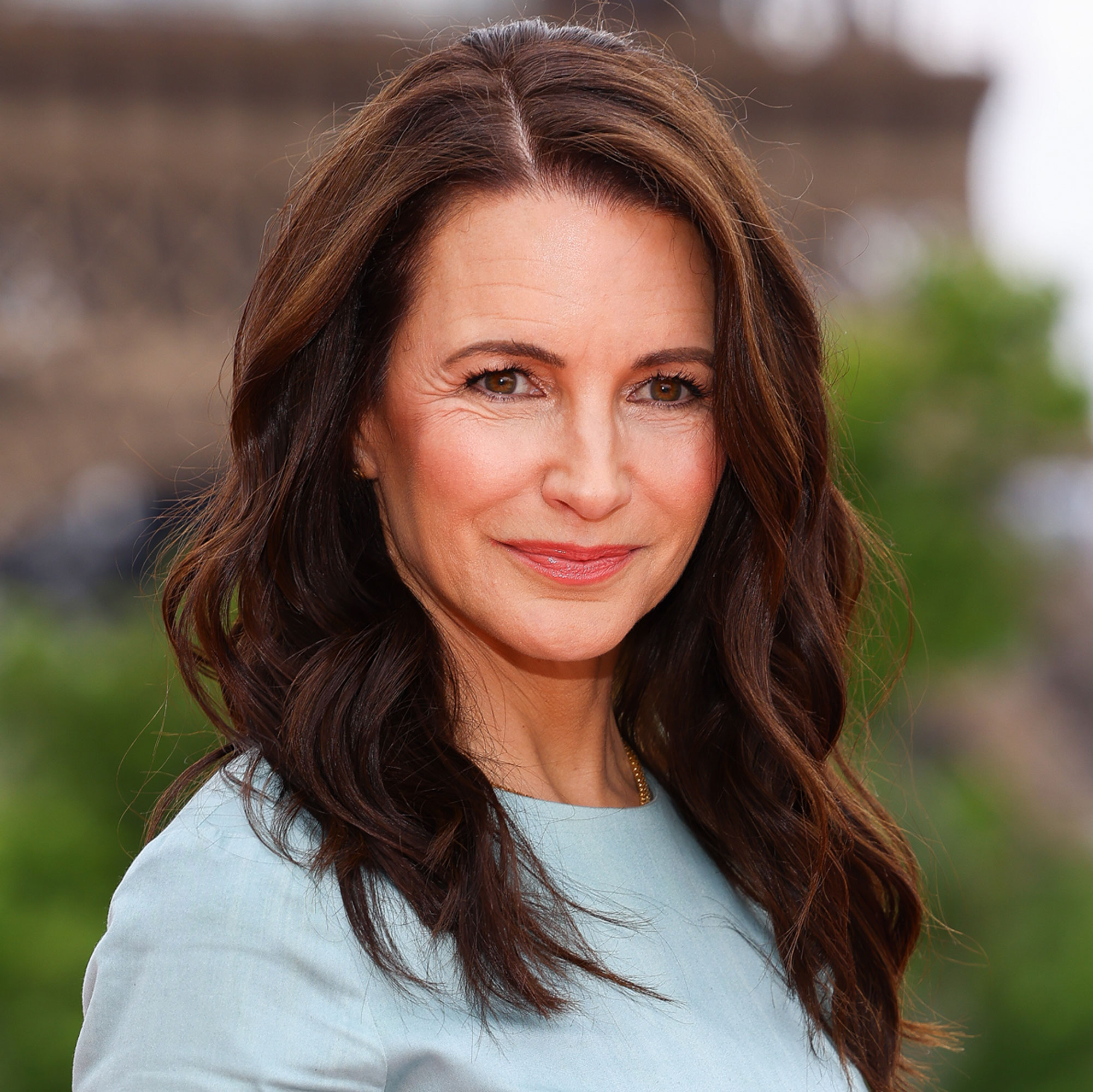 Kristin Davis poses for a photo in Paris