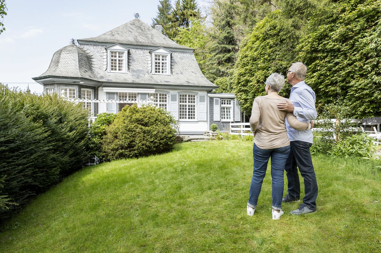 couple in front of house