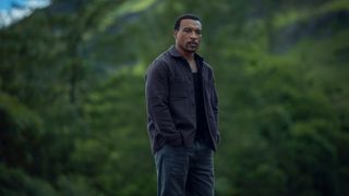 Ashley Walters as Josh standing on a hill in some woods in Missing You