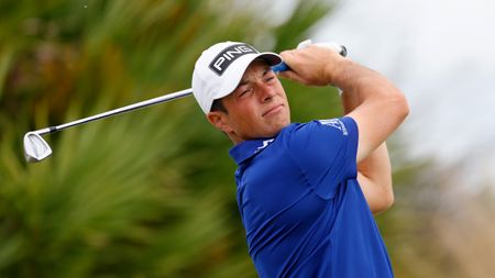 Viktor Hovland holds his pose after taking a tee shot during a practice round at the Hero World Challenge 2023