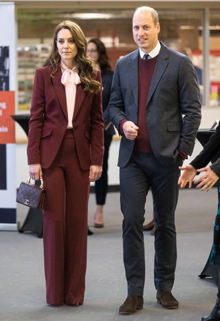 Kate Middleton wearing a burgundy pantsuit