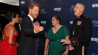 Meghan, Duchess of Sussex, Prince Harry, Duke of Sussex and CWO5 Stephen Rudinski, Valor Award recipient attend the 2021 Salute To Freedom Gala at Intrepid Sea-Air-Space Museum on November 10, 2021 in New York City.