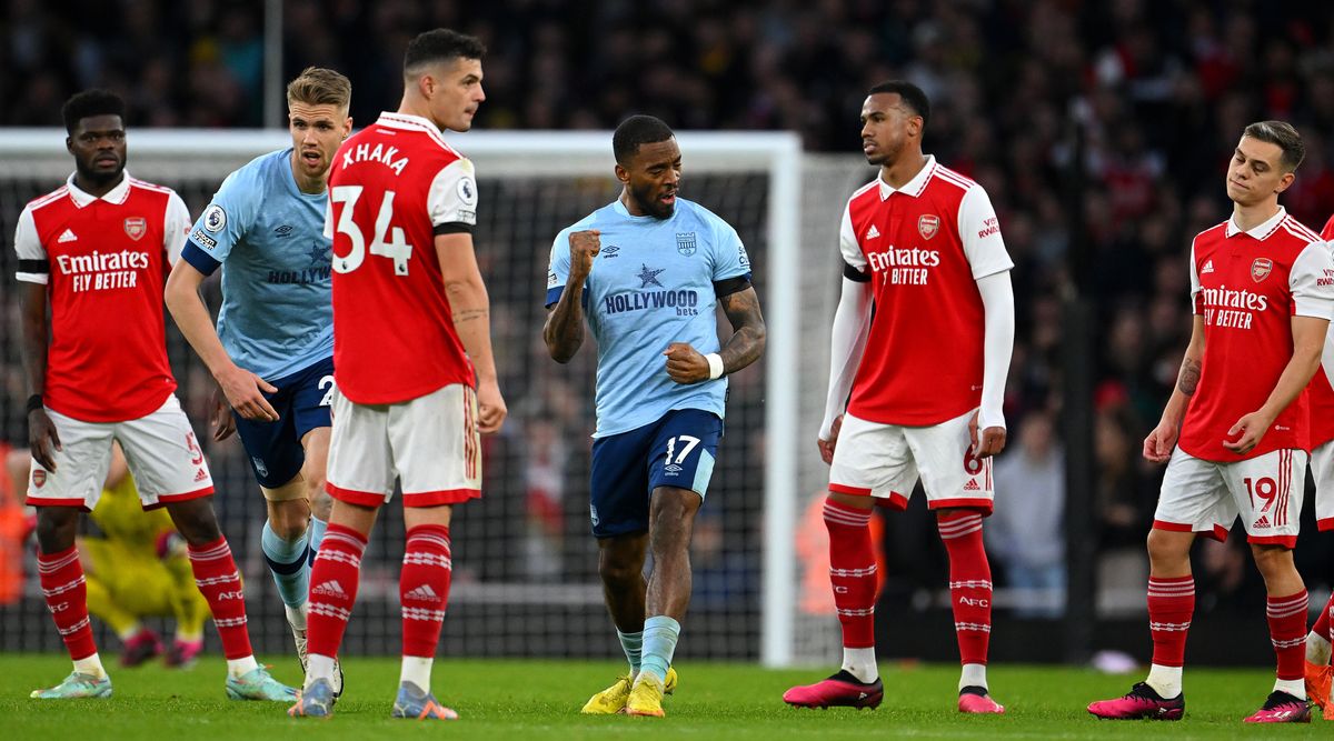 Arsenal&#039;s players react as Ivan Toney of Brentford celebrates scoring his team&#039;s goal during the Premier League match between Arsenal and Brentford at the Emirates Stadium in London, United Kingdom on 11 February, 2023.