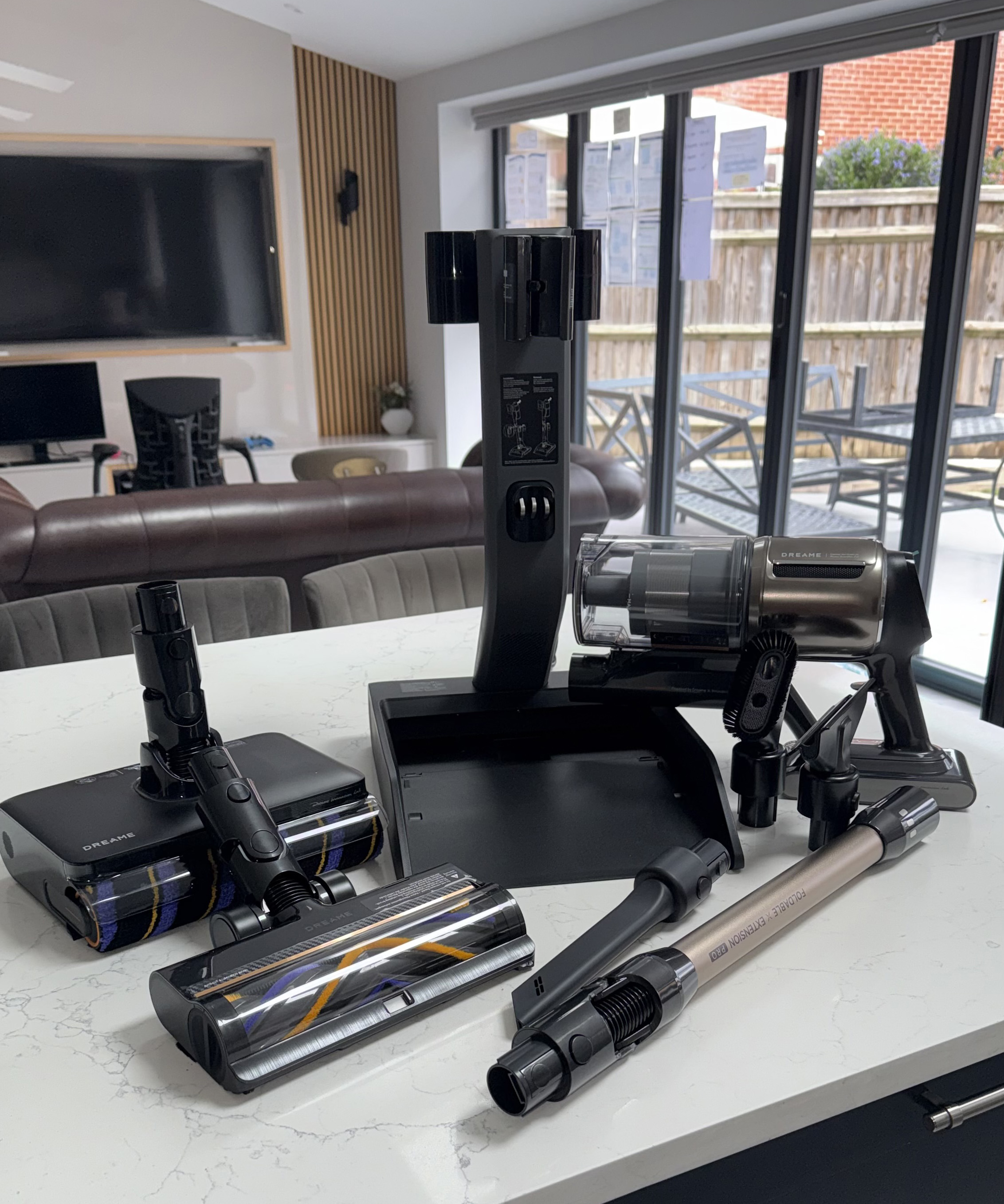 Full Dreame Z30 Pro Aqua vacuum cleaner kit displayed on a kitchen countertop with dock, motor unit, extension tube and floor heads