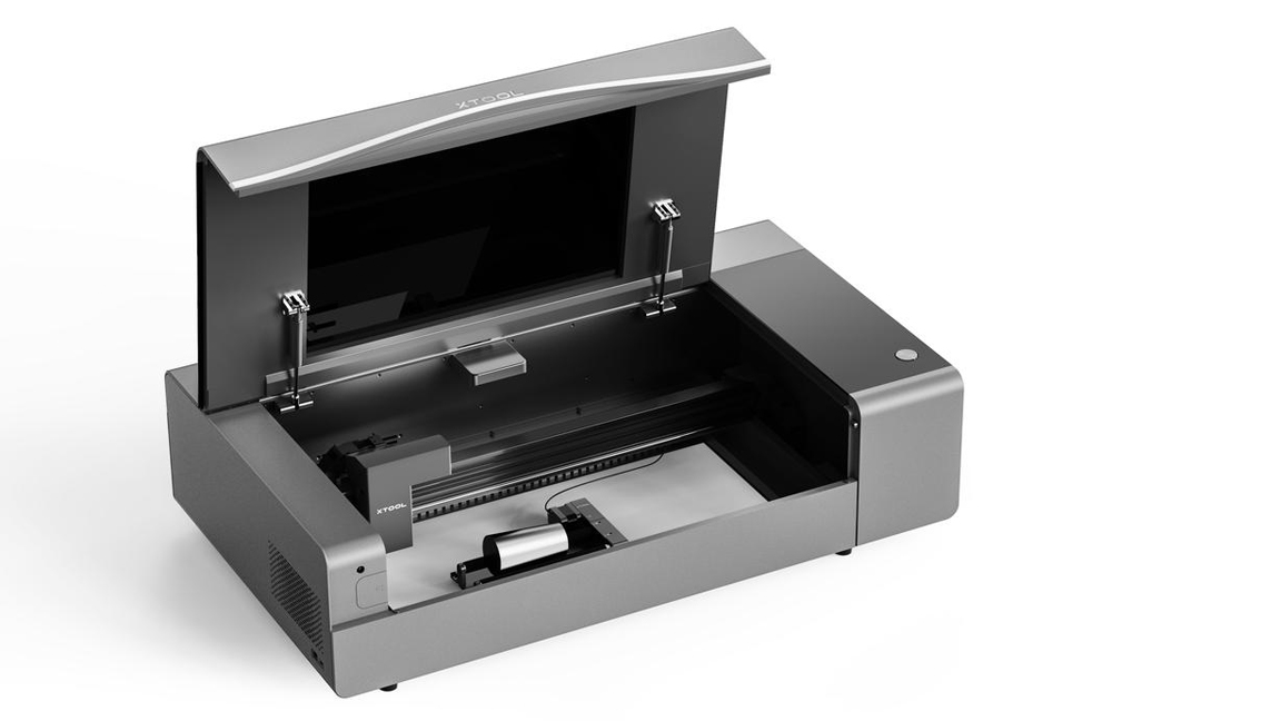 xTool P2; a silver laser cutter with its lid open