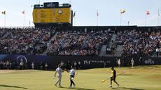 Si Woo Kim and Ryan Gerard shake hands on the final green at The Open in 2026