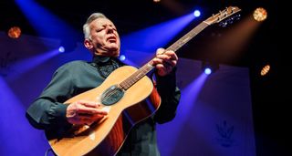 Tommy Emmanuel closes his eyes and goes for it onstage with his trusty Maton acoustic.