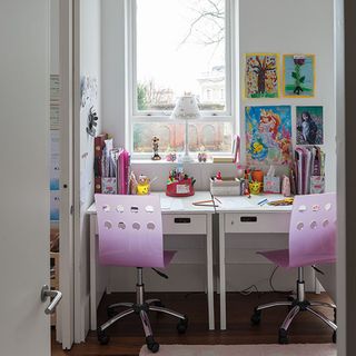 playroom with white wall white desk window and pink chairs