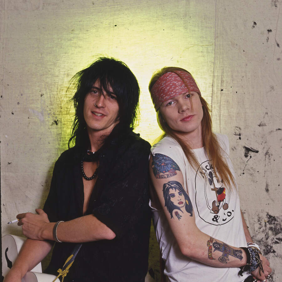 Izzy Stradlin and Axl Rose backstage in 1987