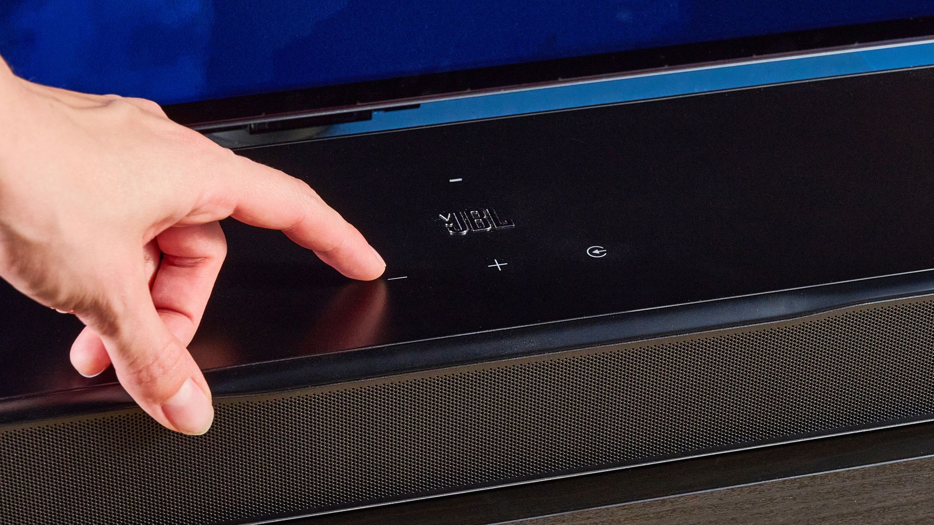 the jbl bar 1300xmk2 in black photographed against the blue tom's guide background