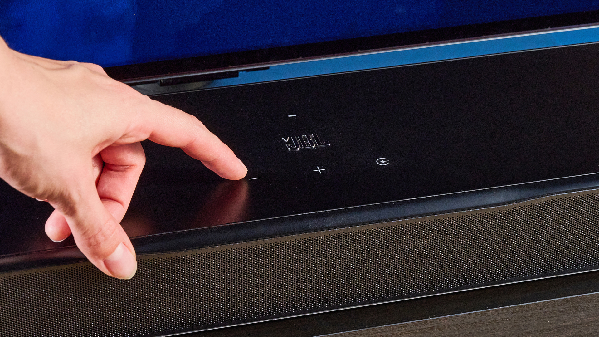 the jbl bar 1300xmk2 in black photographed against the blue tom's guide background