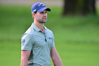 Thomas Detry walks down the fairway