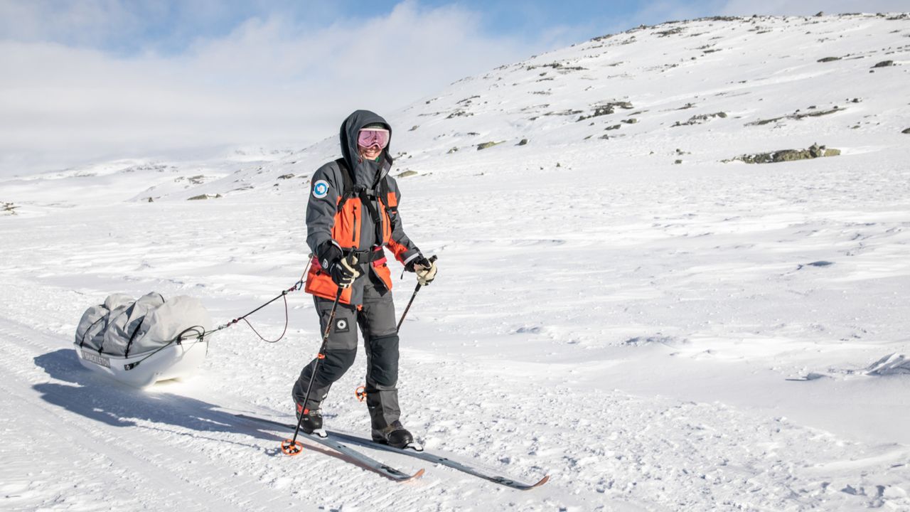 Woman walking across the snow