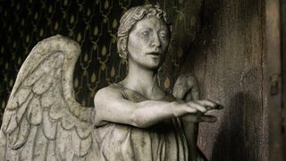 A Weeping Angel extending its arm