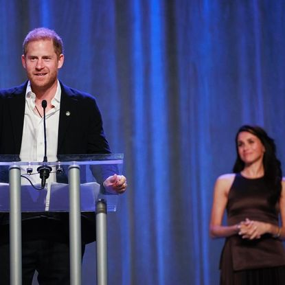 Prince Harry speaks at Invictus Games event in Canada and wife Meghan Markle watches proudly from the sidelines