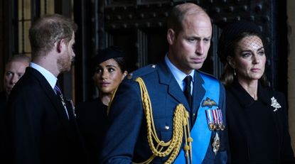 Prince William, Prince of Wales with Catherine, Princess of Wales and Prince Harry with Meghan, Duchess of Sussex leave after escorting the coffin of Queen Elizabeth II to Westminster Hall from Buckingham Palace for her lying in state, on September 14, 2022 in London, United Kingdom.