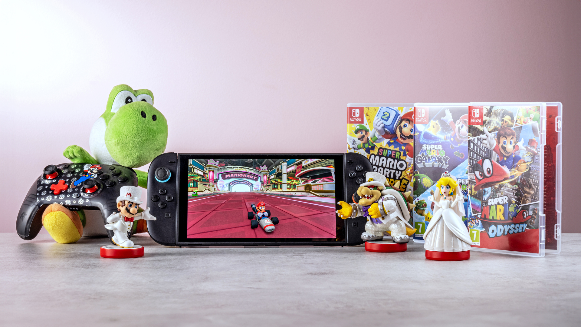 An array of Mario-themed merchandise  and games alongside a Switch 2 console with Mario Kart World being played
