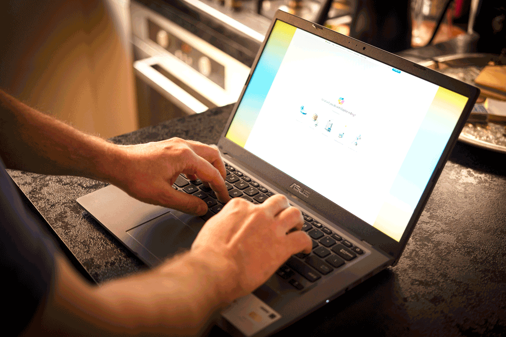 A pair of hands typing on a laptop computer where the Copilot+ logo is displayed.