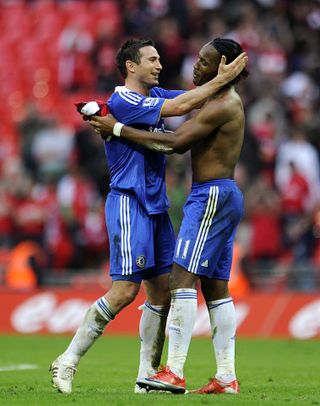 Frank Lampard, left, and Didier Drogba celebrate a win with Chelsea