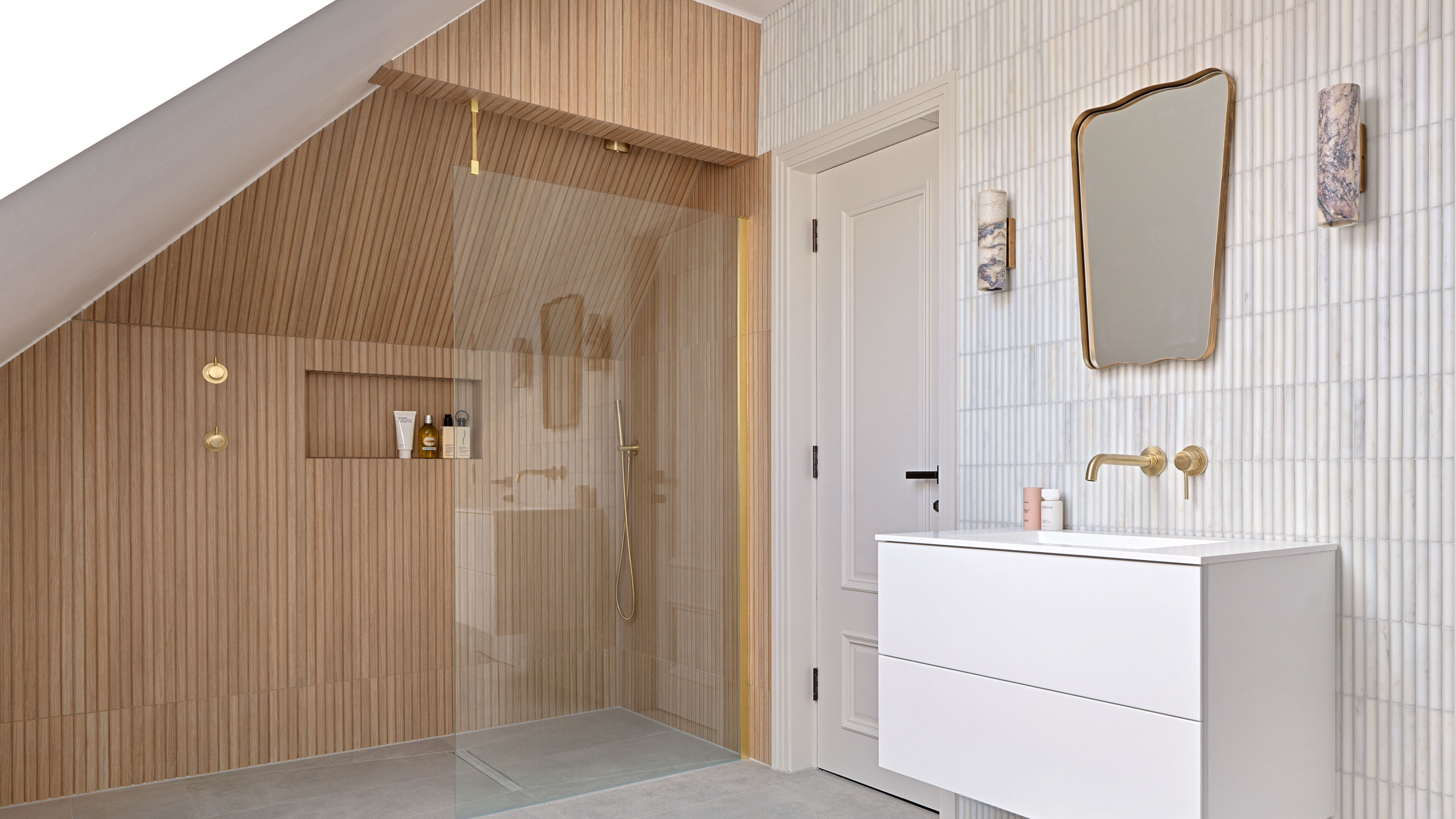 White bathroom with wood clad shower, bamboo tiles and white vanity