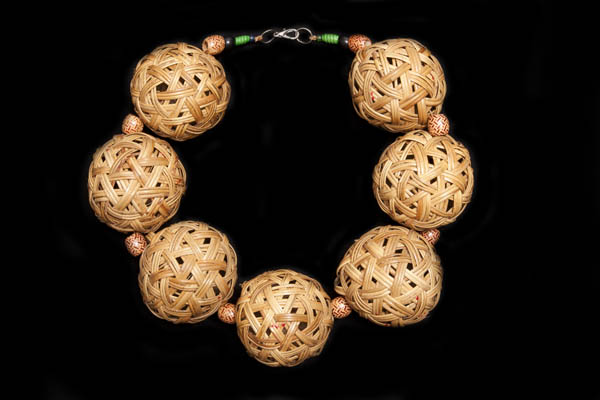 A Thai Necklace of Large Woven Cane Hollow Round Beads With Patterned Wood Barrel Bead Spacers
