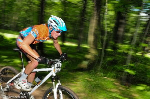 Greg Carpenter streaks through the heavily forested course.