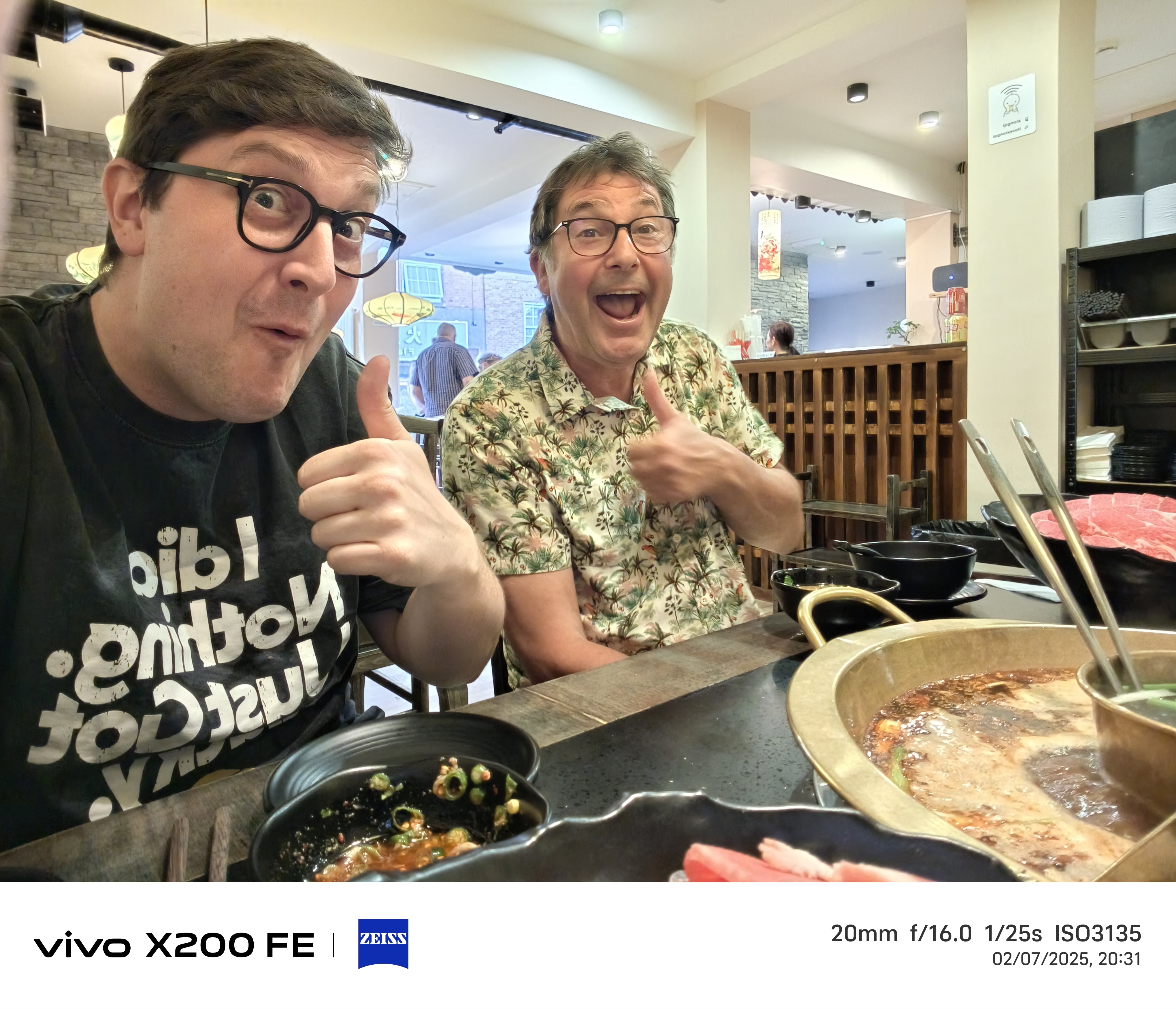 selfie of two people having dinner in a restaurant