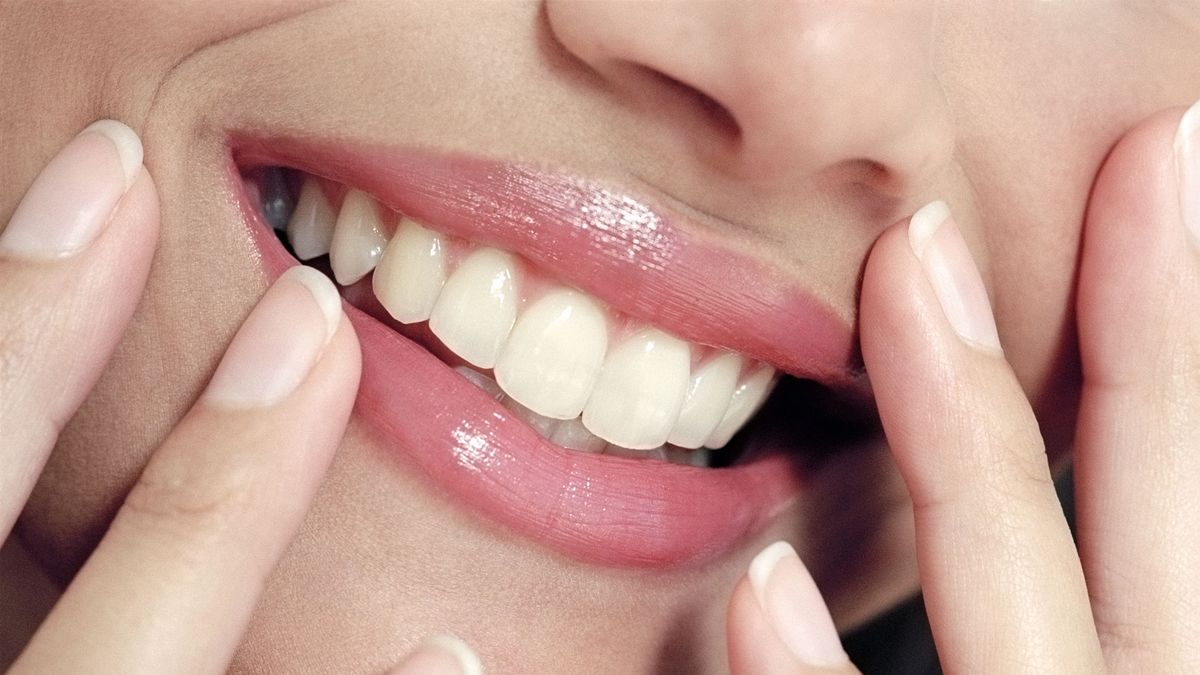 9 teeth facts you probably didn&#039;t know: image shows woman smiling