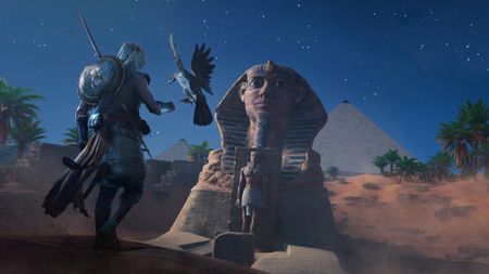 A player looking at a Sphinx while holding a hawk during Assassin's Creed Origins. 
