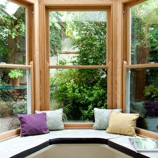 window seat with bright cushions