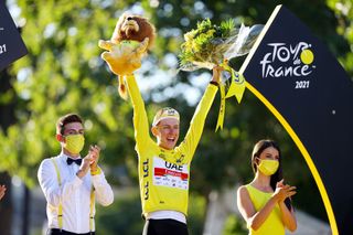PARIS FRANCE JULY 18 Tadej Pogaar of Slovenia and UAETeam Emirates Yellow Leader Jersey celebrates at podium during the 108th Tour de France 2021 Stage 21 a 1084km stage from Chatou to Paris Champslyses Lion Mascot LeTour TDF2021 on July 18 2021 in Paris France Photo by Tim de WaeleGetty Images