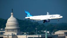 Airplane flies in front of U.S. Capitol en route to Reagan National