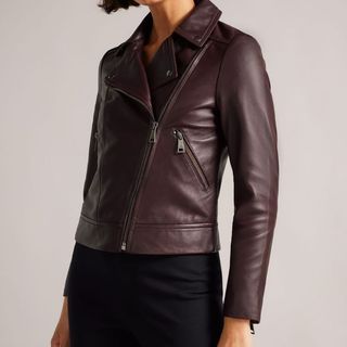 model wearing a dark purple ted baker fitted leather biker jacket
