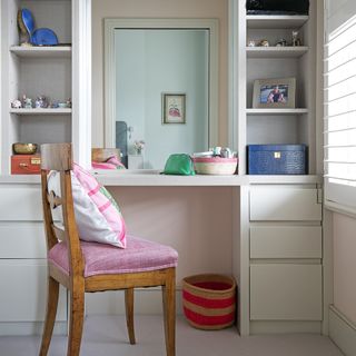 dressing room with wooden shelves and chair