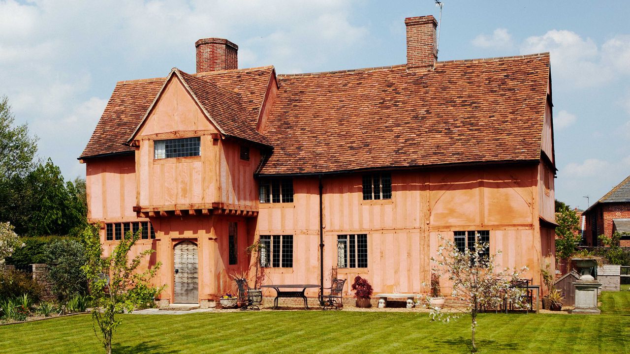 Tudor home with jettied four-centred arch door