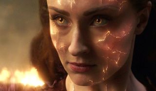 Dark Phoenix Jean Grey's fiery face in front of some burning wreckage