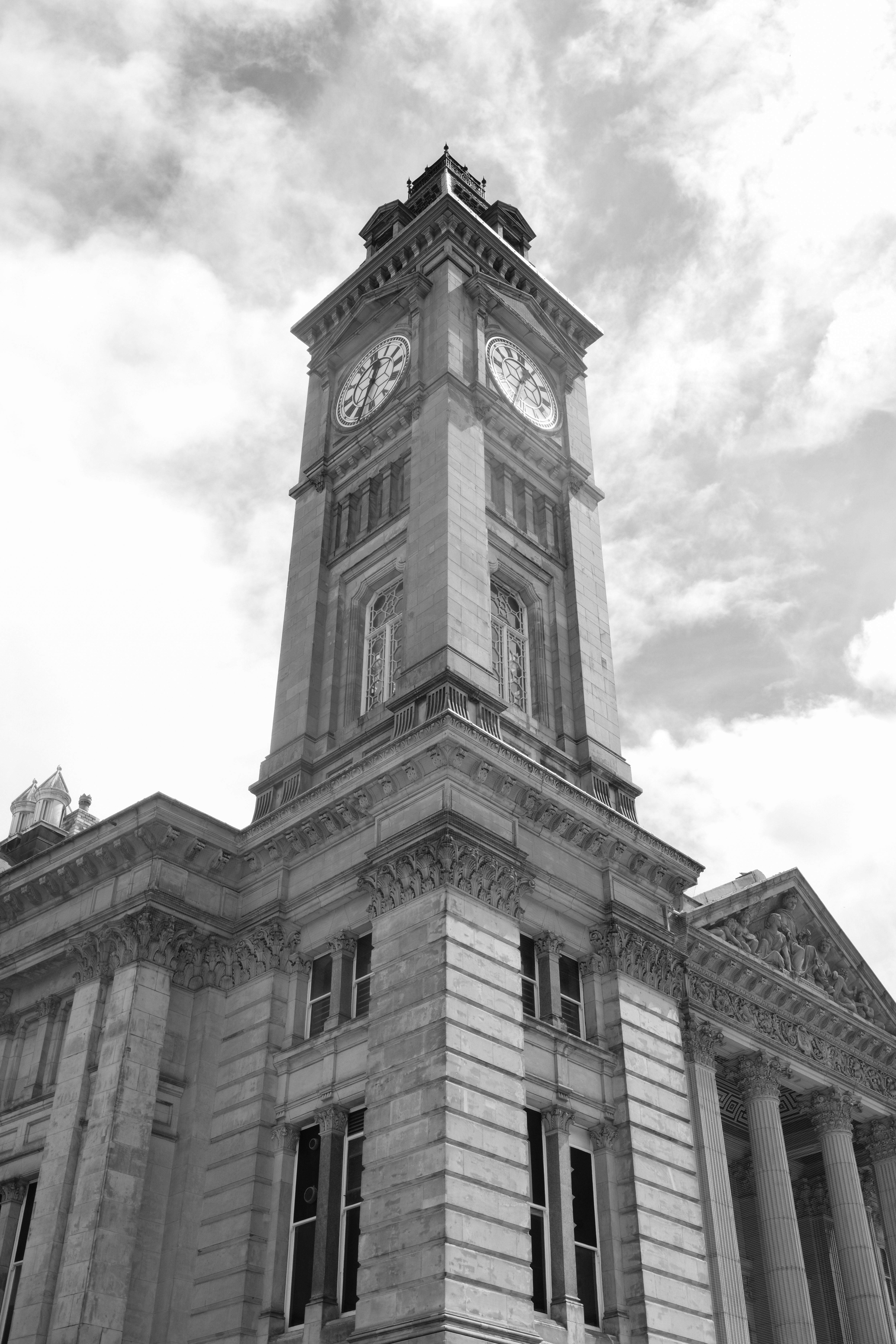 A black and white photo of a clock tower taken on the Fujifilm X-E5.