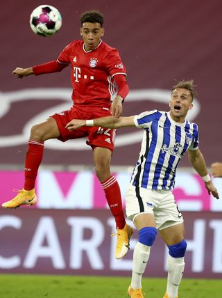 Bayern Munich’s Jamal Musiala, left, has earned the trust of head coach Hansi Flick and played four times this season