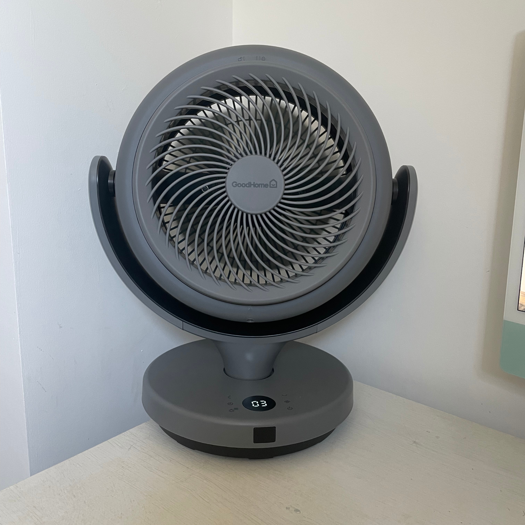 grey GoodHome 8 24W Remote Controlled Table Fan sitting on a white desk