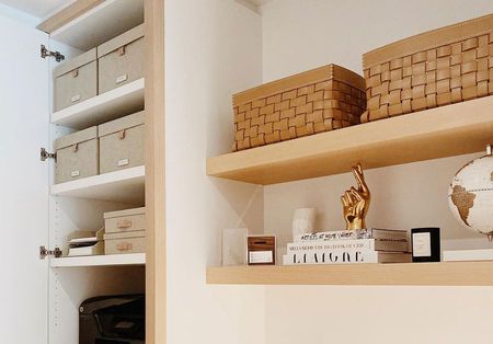 Ogranized above desk space with open shelving and cupboards