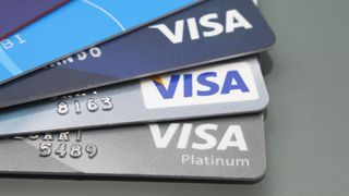 Close-up of Visa credit cards placed on a dark background