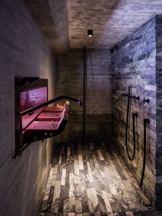 The former cannon loading hatch now creates a visual connection between the shower and the jacuzzi