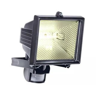 Black floodlight with the light turned on on a white background