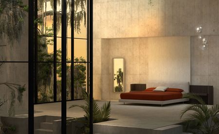 Bedroom in a brutalist, tropical room with concrete floors and tall windows