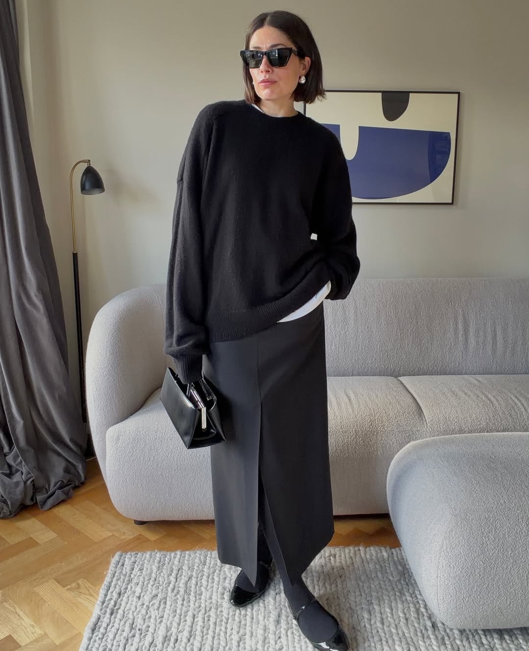 Woman wearing layering outfit idea 2026.