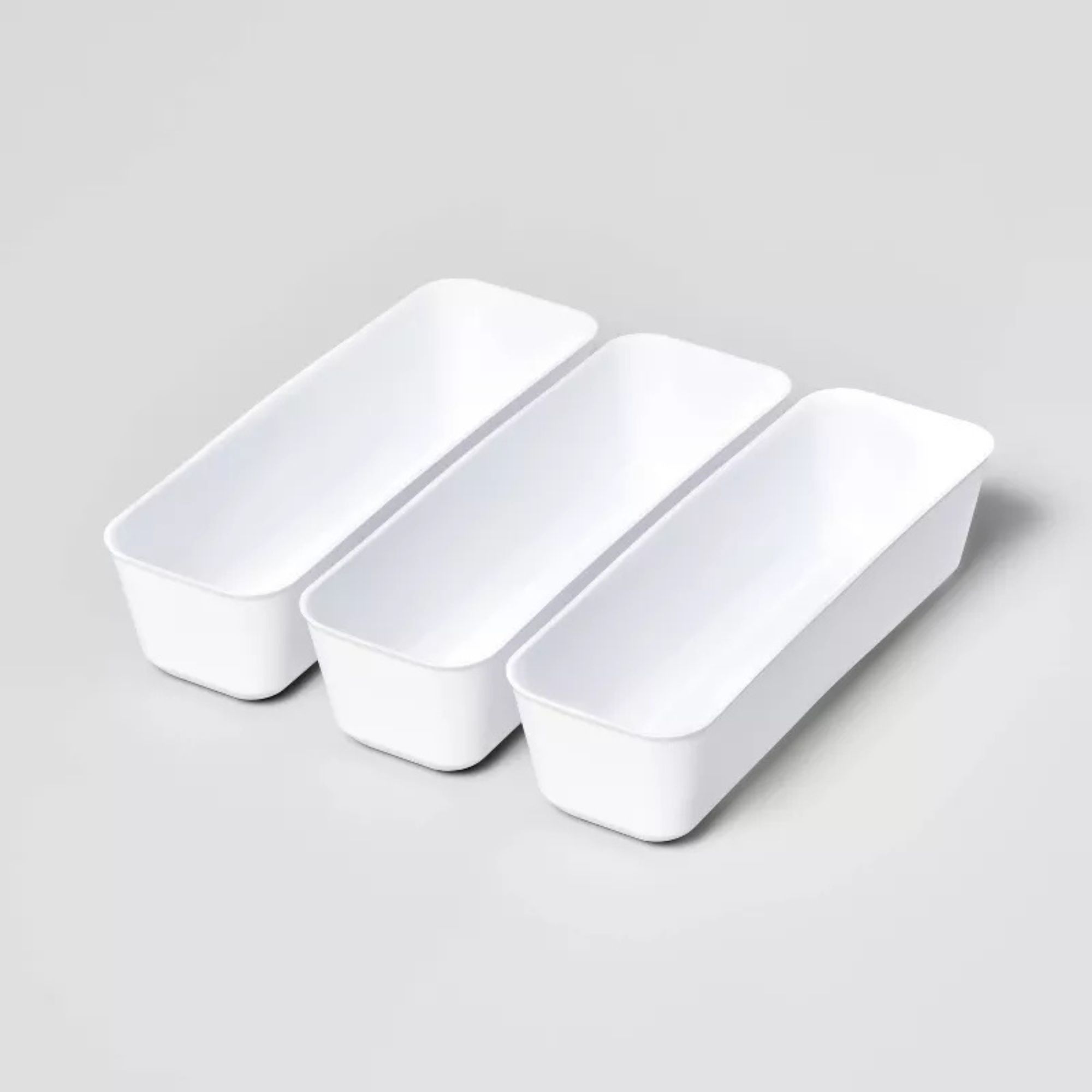 BPA-free white drawer organizers in pack of three. They're long and slim