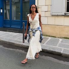 Influencer wearing a casual cream-colored maxi dress
